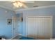 Bright bedroom featuring a large closet, light blue walls and a ceiling fan at 3216 Purple Martin Dr # 121, Punta Gorda, FL 33950