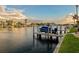 Waterfront property featuring a private boat dock and lift, offering quick access to the open water at 3216 Purple Martin Dr # 121, Punta Gorda, FL 33950