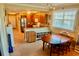 Open kitchen with stainless appliances, ample counter space, and dining area at 3216 Purple Martin Dr # 121, Punta Gorda, FL 33950