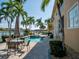 Backyard area featuring a pool, outdoor seating, and water views at 3216 Purple Martin Dr # 121, Punta Gorda, FL 33950
