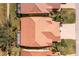 Stunning aerial view of a home featuring a terra cotta roof, mature trees and lush green landscaping at 3748 Albacete Cir # 38, Punta Gorda, FL 33950