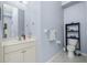 Bathroom featuring a single sink, toilet, tile floors and great lighting at 3748 Albacete Cir # 38, Punta Gorda, FL 33950