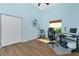 Bright bedroom with laminate flooring, ceiling fan, and large windows with natural light at 3748 Albacete Cir # 38, Punta Gorda, FL 33950