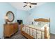 Bedroom with a bamboo bed, dresser and wood grain floors at 3748 Albacete Cir # 38, Punta Gorda, FL 33950