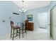 Cozy dining area with modern furniture, adjacent to the kitchen and hallway at 3748 Albacete Cir # 38, Punta Gorda, FL 33950