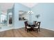 Bright dining room with chandelier and access to kitchen and living areas at 3748 Albacete Cir # 38, Punta Gorda, FL 33950