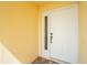 The front door has a sidelight window and is well-lit by the exterior paint color at 3748 Albacete Cir # 38, Punta Gorda, FL 33950
