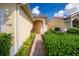 Inviting front entrance featuring a well-manicured walkway and lush landscaping at 3748 Albacete Cir # 38, Punta Gorda, FL 33950