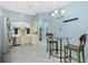 Bright kitchen with stainless steel appliances, breakfast nook and white tile flooring at 3748 Albacete Cir # 38, Punta Gorda, FL 33950