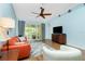 Cozy living room featuring laminate flooring, a ceiling fan, and sliding glass doors to patio at 3748 Albacete Cir # 38, Punta Gorda, FL 33950