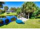 Beautiful backyard with a small pond and a dock, perfect for enjoying nature and outdoor activities at 429 Dorchester St, Port Charlotte, FL 33954