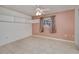 Bedroom with neutral tile floor, and a window dressed with patterned curtains at 429 Dorchester St, Port Charlotte, FL 33954