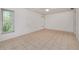 Neutral bedroom with tile flooring, bright window, and ample natural light at 429 Dorchester St, Port Charlotte, FL 33954