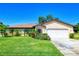 Charming one-story home with a well-manicured lawn and a two-car garage in a quiet neighborhood at 429 Dorchester St, Port Charlotte, FL 33954