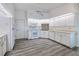 Well-lit kitchen with white cabinetry, modern appliances, and sleek flooring, providing a clean and functional space at 429 Dorchester St, Port Charlotte, FL 33954