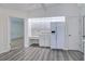 Bright kitchen featuring white cabinets, modern appliances, desk area and plank flooring at 429 Dorchester St, Port Charlotte, FL 33954