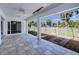 Screened lanai with tiled floors, outdoor ceiling fan, and view of the backyard at 429 Dorchester St, Port Charlotte, FL 33954