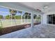 Lanai with tile floor and view of the well-maintained yard at 429 Dorchester St, Port Charlotte, FL 33954