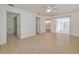 Bright main bedroom featuring tile flooring, access to bathroom and kitchen, and sliding glass doors at 429 Dorchester St, Port Charlotte, FL 33954