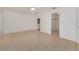 Spacious main bedroom with tile floors, neutral walls, and attached bathroom and closet at 429 Dorchester St, Port Charlotte, FL 33954