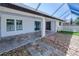 Outdoor patio with tiled flooring and partial view of the backyard at 429 Dorchester St, Port Charlotte, FL 33954