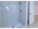 Bright tile shower with showerhead and corner shelves at 429 Dorchester St, Port Charlotte, FL 33954