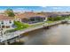Aerial shot showing beautiful backyard with pool, lanai, boat dock, seawall and canal views at 4320 Vasco St, Punta Gorda, FL 33950