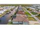 Aerial view of waterfront homes lining a canal with boat docks and lush green landscaping at 4320 Vasco St, Punta Gorda, FL 33950