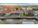 Waterfront home features a private dock, screened pool area, and lush green lawn at 4320 Vasco St, Punta Gorda, FL 33950
