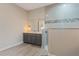 Modern bathroom featuring single vanity, quartz countertop and walk-in shower at 4320 Vasco St, Punta Gorda, FL 33950