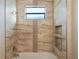 Bathroom featuring a tub with tiled walls, niche, granite countertops and stylish fixtures at 4320 Vasco St, Punta Gorda, FL 33950