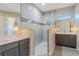 Modern bathroom featuring double vanity, quartz countertop and walk-in shower at 4320 Vasco St, Punta Gorda, FL 33950