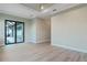 Bedroom featuring tray ceiling, ceiling fan, and sliding glass door to the pool at 4320 Vasco St, Punta Gorda, FL 33950