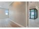 Spacious bedroom with wood-look tile flooring and glass door to outside patio at 4320 Vasco St, Punta Gorda, FL 33950