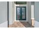 Elegant entryway boasting double doors with decorative glass, complemented by a paver walkway at 4320 Vasco St, Punta Gorda, FL 33950