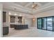 Well-appointed kitchen with a central island, modern cabinetry, and a sliding glass door overlooking the pool area at 4320 Vasco St, Punta Gorda, FL 33950