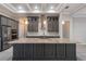 Kitchen with granite countertops, stainless steel appliances, wood cabinets, and modern lighting at 4320 Vasco St, Punta Gorda, FL 33950