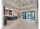 Spacious kitchen featuring a large island, stainless steel appliances, and an open view to the pool at 4320 Vasco St, Punta Gorda, FL 33950