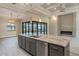 A spacious open-plan kitchen features a large island with granite countertops and stainless steel appliances at 4320 Vasco St, Punta Gorda, FL 33950
