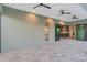 Covered lanai featuring tile flooring, multiple ceiling fans, and views of the well-equipped kitchen at 4320 Vasco St, Punta Gorda, FL 33950