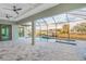 Covered lanai with ceiling fans and a view of the pool, spa, and the neighborhood canal at 4320 Vasco St, Punta Gorda, FL 33950