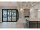 Spacious living room with sliding glass doors opening to the pool area and kitchen island at 4320 Vasco St, Punta Gorda, FL 33950