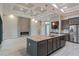 Open concept kitchen and living room featuring tile floors, recessed lighting, and modern design at 4320 Vasco St, Punta Gorda, FL 33950