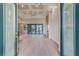 Open-concept living room featuring tile floors, a decorative ceiling, and sliding glass doors to the pool at 4320 Vasco St, Punta Gorda, FL 33950