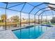 Screened-in pool overlooking waterfront and neighborhood at 4320 Vasco St, Punta Gorda, FL 33950