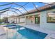 Beautiful pool with screened-in enclosure and outdoor patio area at 4320 Vasco St, Punta Gorda, FL 33950