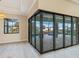 Sunroom with sliding glass doors overlooking the outdoor pool and patio area at 4320 Vasco St, Punta Gorda, FL 33950