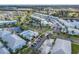 An aerial view of condos with ponds and manicured landscaping at 5783 Sabal Trace Dr # 103B57, North Port, FL 34287