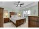 Serene main bedroom with a wooden bed frame, decorative lamps, and a calming color palette at 5783 Sabal Trace Dr # 103B57, North Port, FL 34287