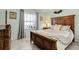 Comfortable bedroom showcasing a large bed, neutral walls, and ample natural light at 5783 Sabal Trace Dr # 103B57, North Port, FL 34287